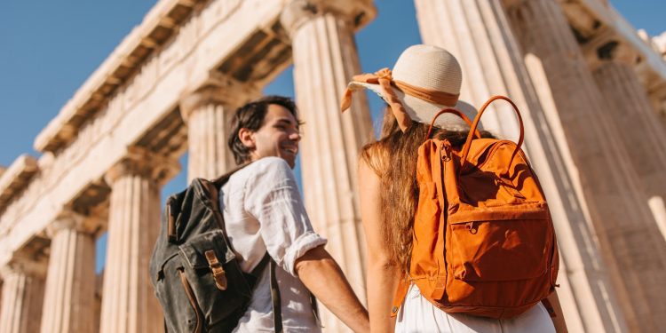 Tourist in front of the Parthenon temple