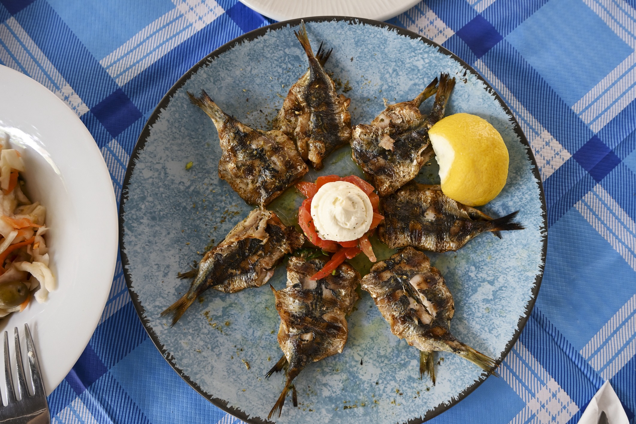 grilled sardines on dish