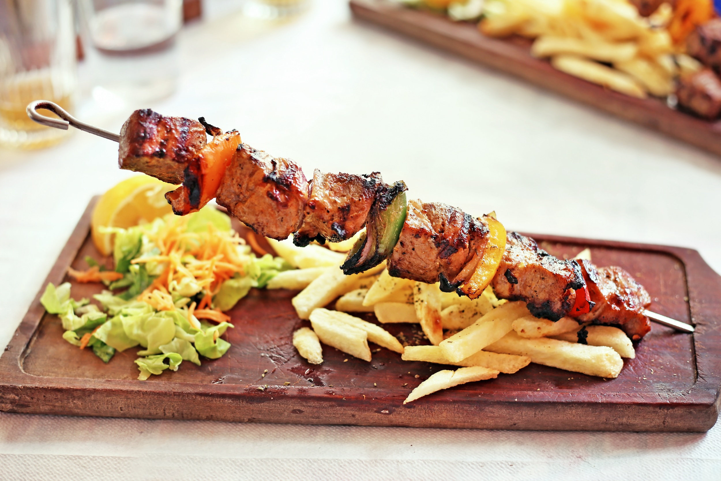 traditional greek souvlaki with chicken and potatoes - greek kontosouvli