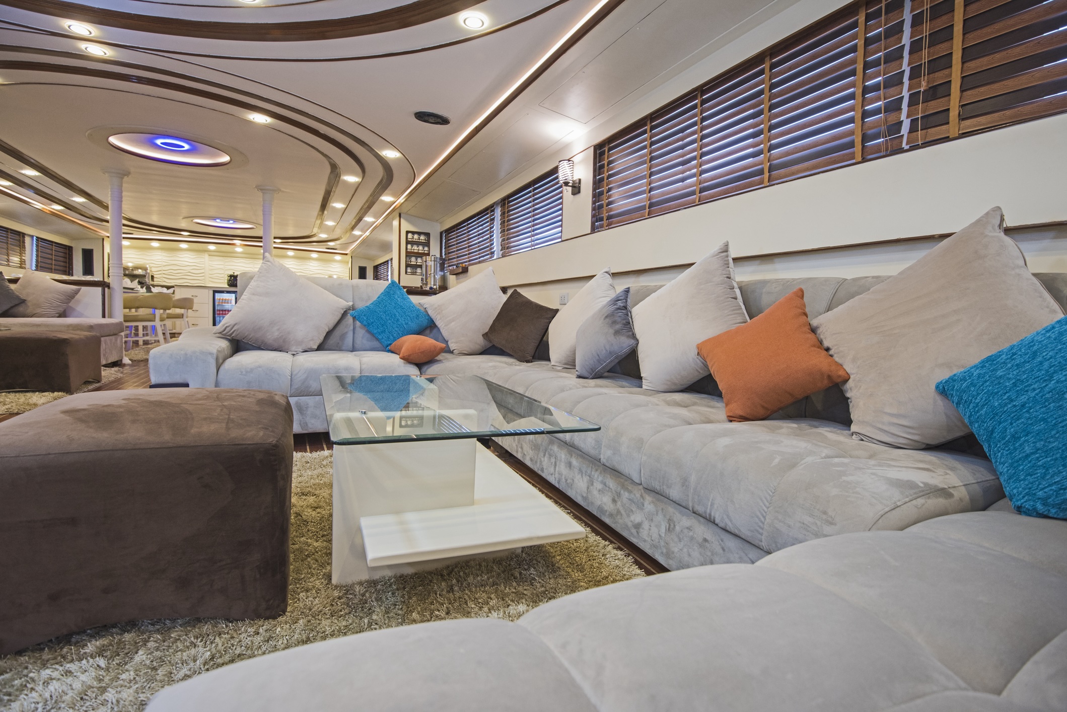 Interior of large salon area of luxury motor yacht