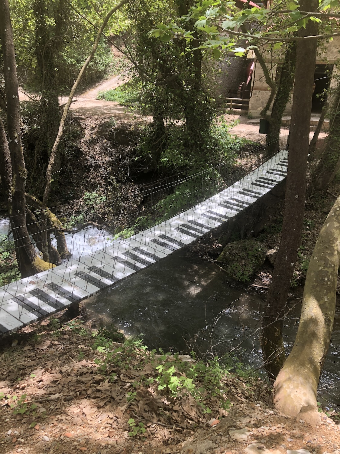 A unique suspension bridge with piano keys painted on the steps