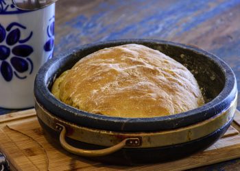 Fresh homemade bread with organic ingredients over rustic table