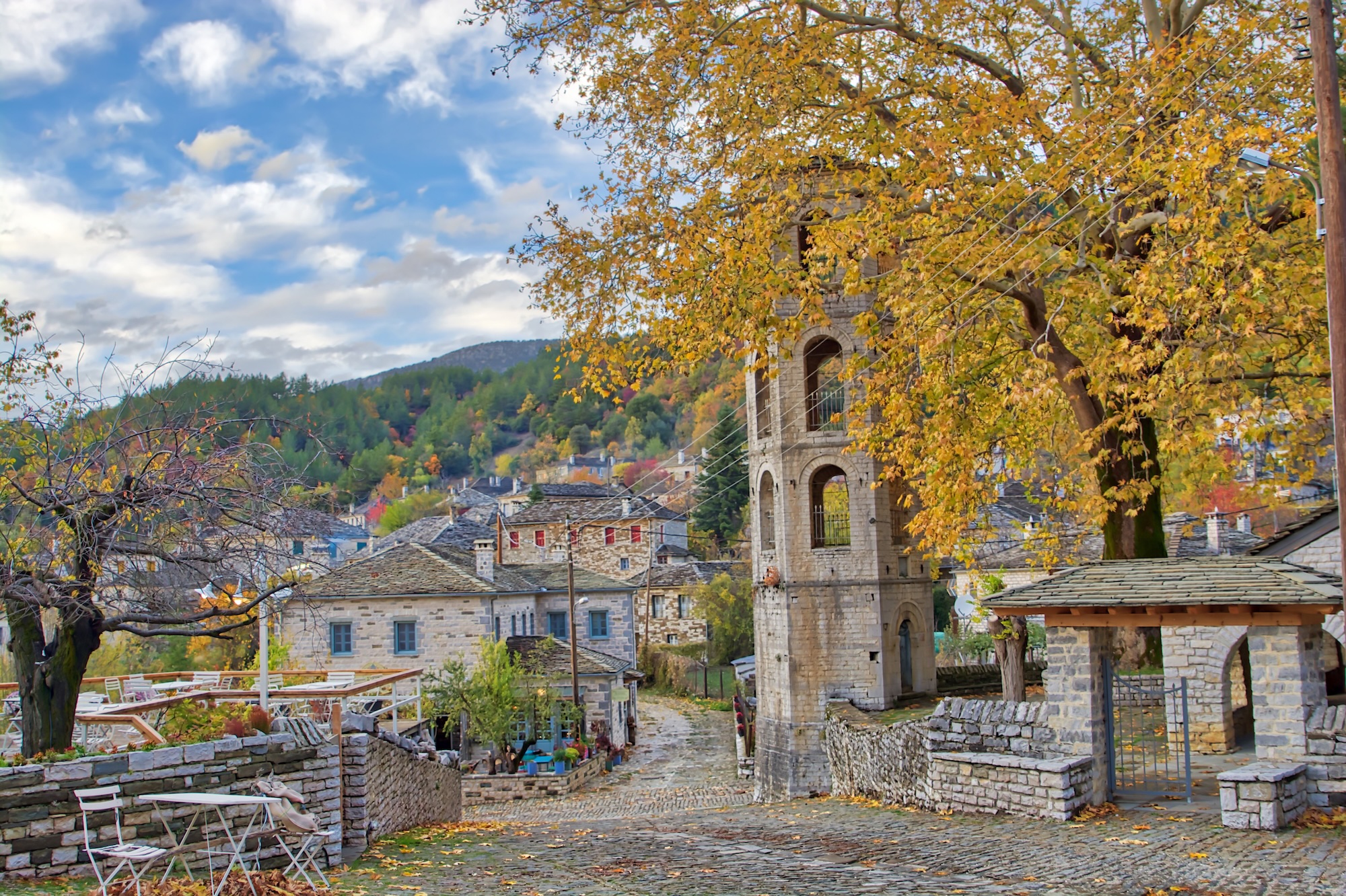 Sunset on a traditional alley in Megalo Papingo village in Ioannina, Greece on a autumn day