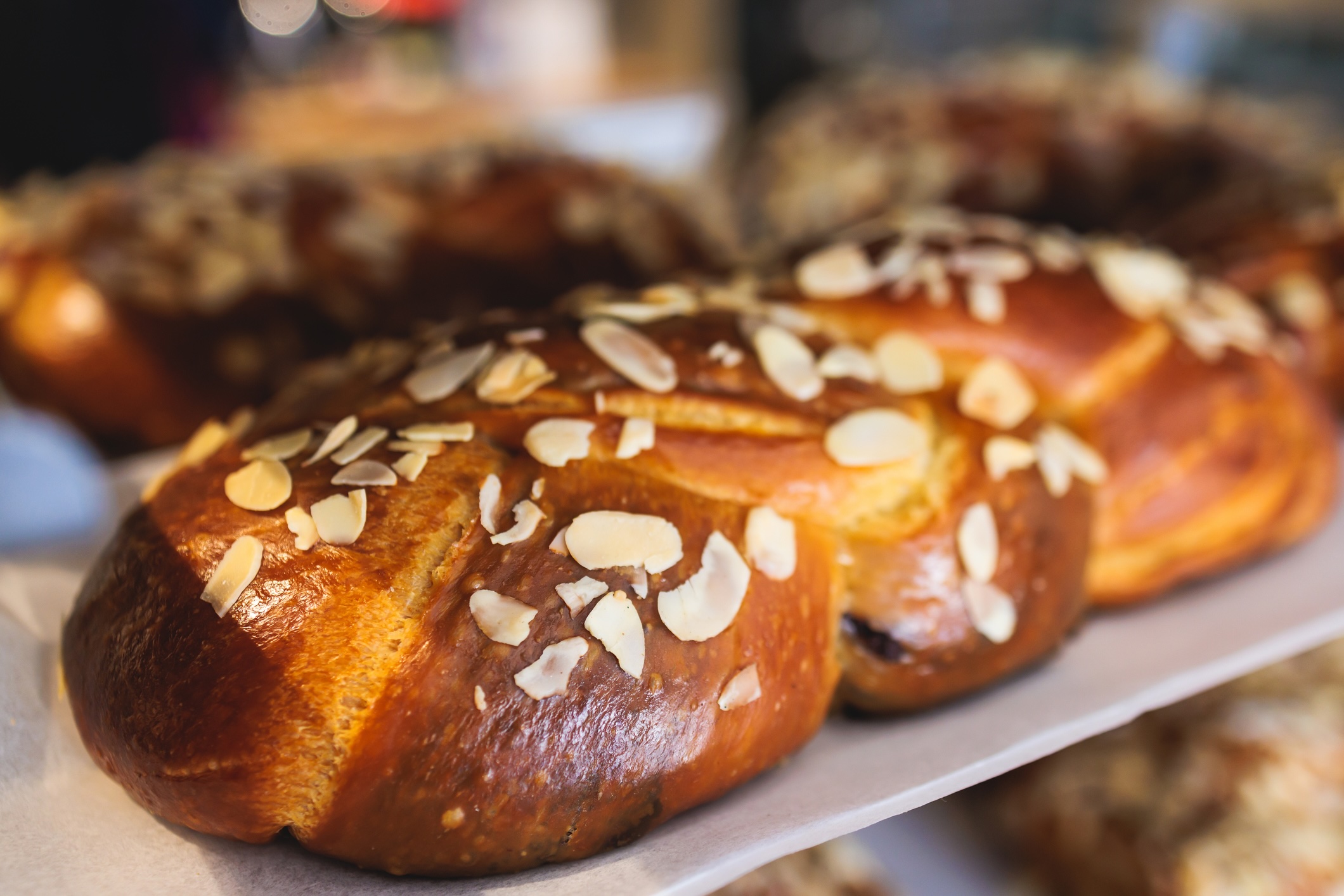 Tsoureki, Traditional Greek Easter Bread, greek freshly baked cake in Athens, Greece, with almond, mastiha, mahleb and cinnamon, orthodox Easter in Greece, sweet bread with red eggs