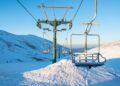 Empty chairlifts in a ski resort on a sunny day