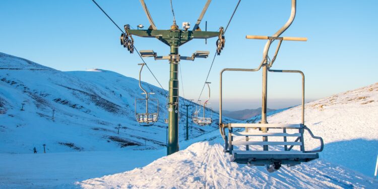 Empty chairlifts in a ski resort on a sunny day