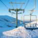 Empty chairlifts in a ski resort on a sunny day