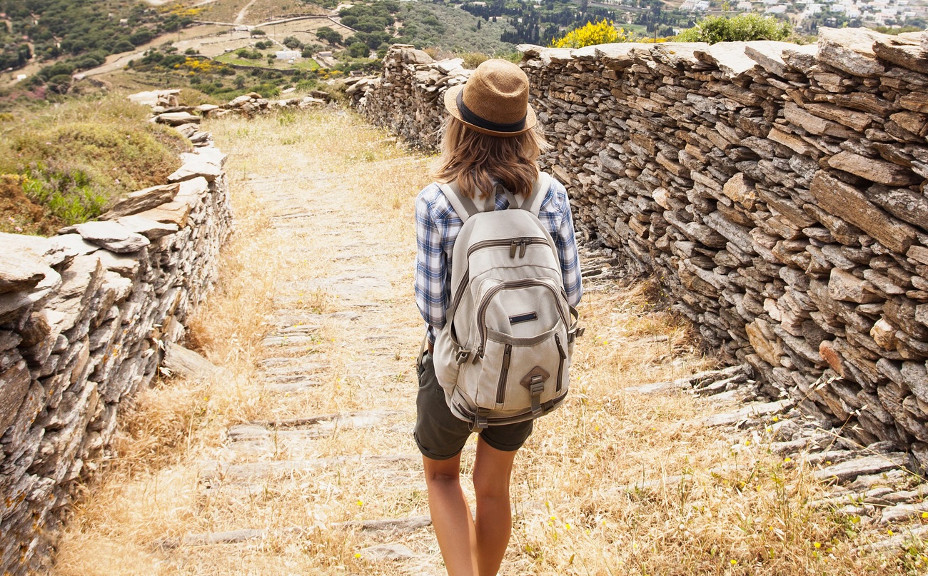 Young girl hiker on mountain trail