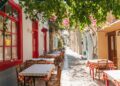 The cozy Greek city of Nafplion in the summer, blooming streets and restaurants. The first capital of Greece.