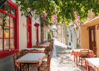 The cozy Greek city of Nafplion in the summer, blooming streets and restaurants. The first capital of Greece.