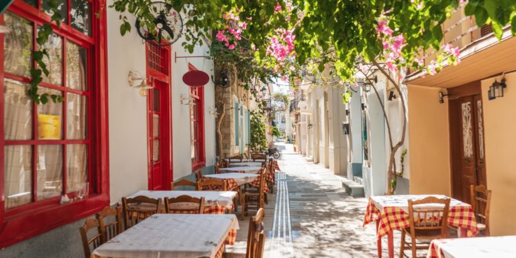 The cozy Greek city of Nafplion in the summer, blooming streets and restaurants. The first capital of Greece.